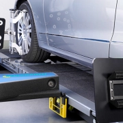 Mechanic performing wheel alignment on a car at worskhop by CarStreet2u – car maintenance tip